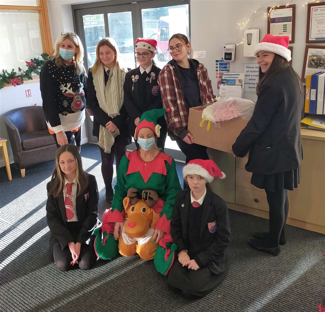 Pupils from Oasis Academy Isle of Sheppey delivering Christmas gifts to the elderly