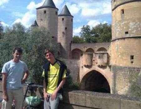 Sam Swain, right, with a local who showed him around Metz durin gthe epic bike ride to Japan