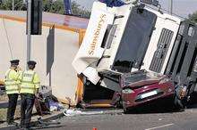 Woman's car crushed by lorry