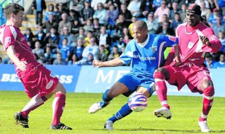 Gillingham striker Simeon Jackson in action against Bury
