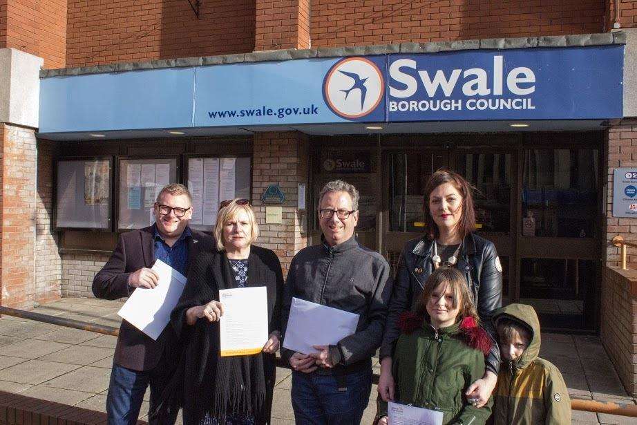 Lib Dem campaigners Ben Martin Denise Knights, Eddie Thomas and Hannah Perkin with Scarlet & Dexter preparing to hand in the petition to Swale Borough Council at Swale House in Sittingbourne (7271453)