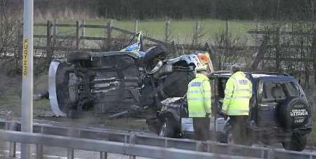 The scene of the crash with the police car on the left. Picture: MARTIN APPS