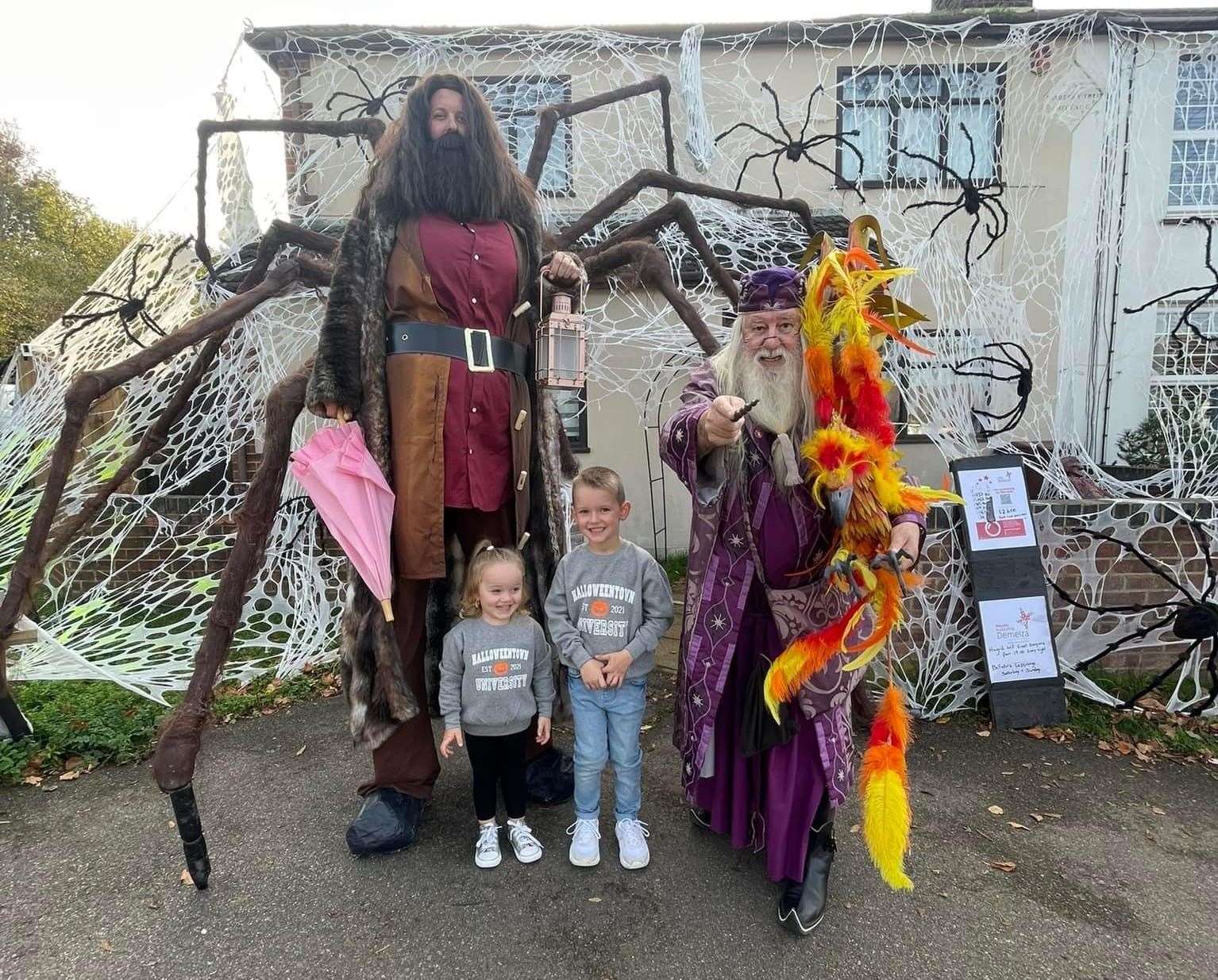 Kieron King (dressed as Hagrid, left), his children Scarlett and Charlie, with Professor Dumbledore. Picture: Kieron King