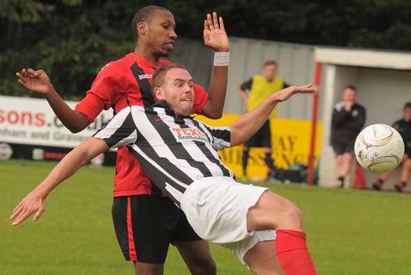 Chatham Town player Corey Holder, in red, has had his spleen removed
