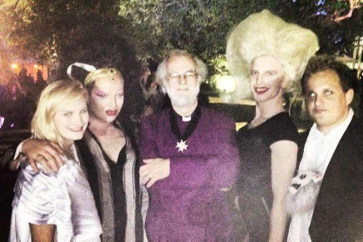 Former Archbishop of Canterbury Rowan Williams with drag queens at the Magdelene College ball in Cambridge