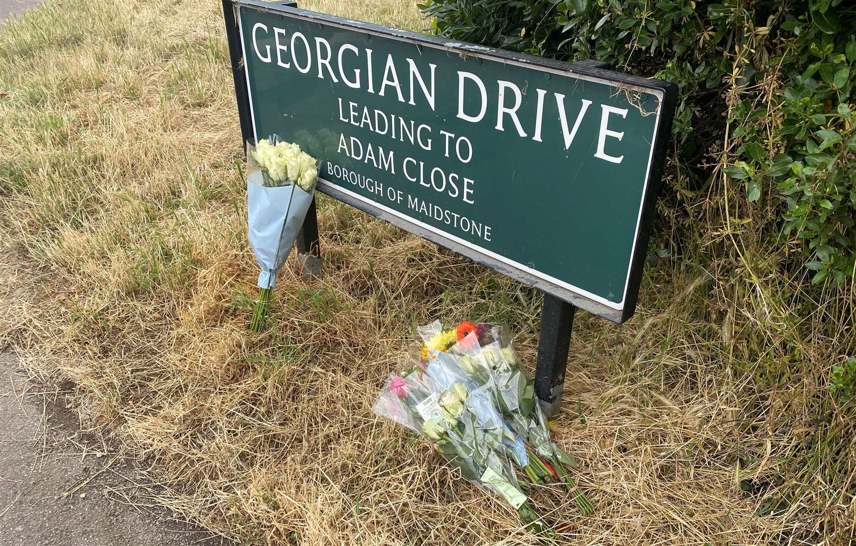 Flowers have been left at the roadside
