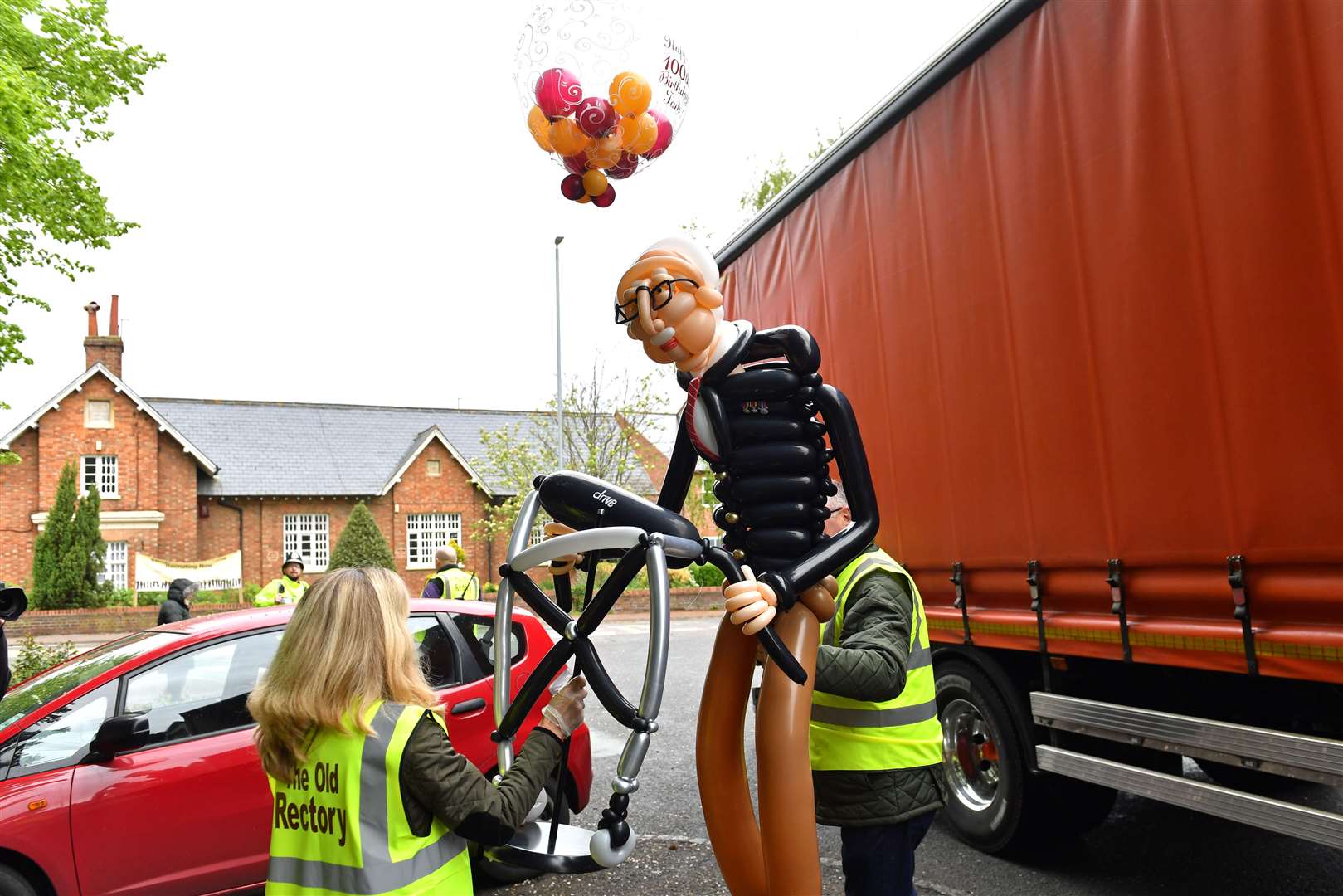 A customised balloon of Captain Tom was among the items delivered to the centenarian (Jacob King/PA)