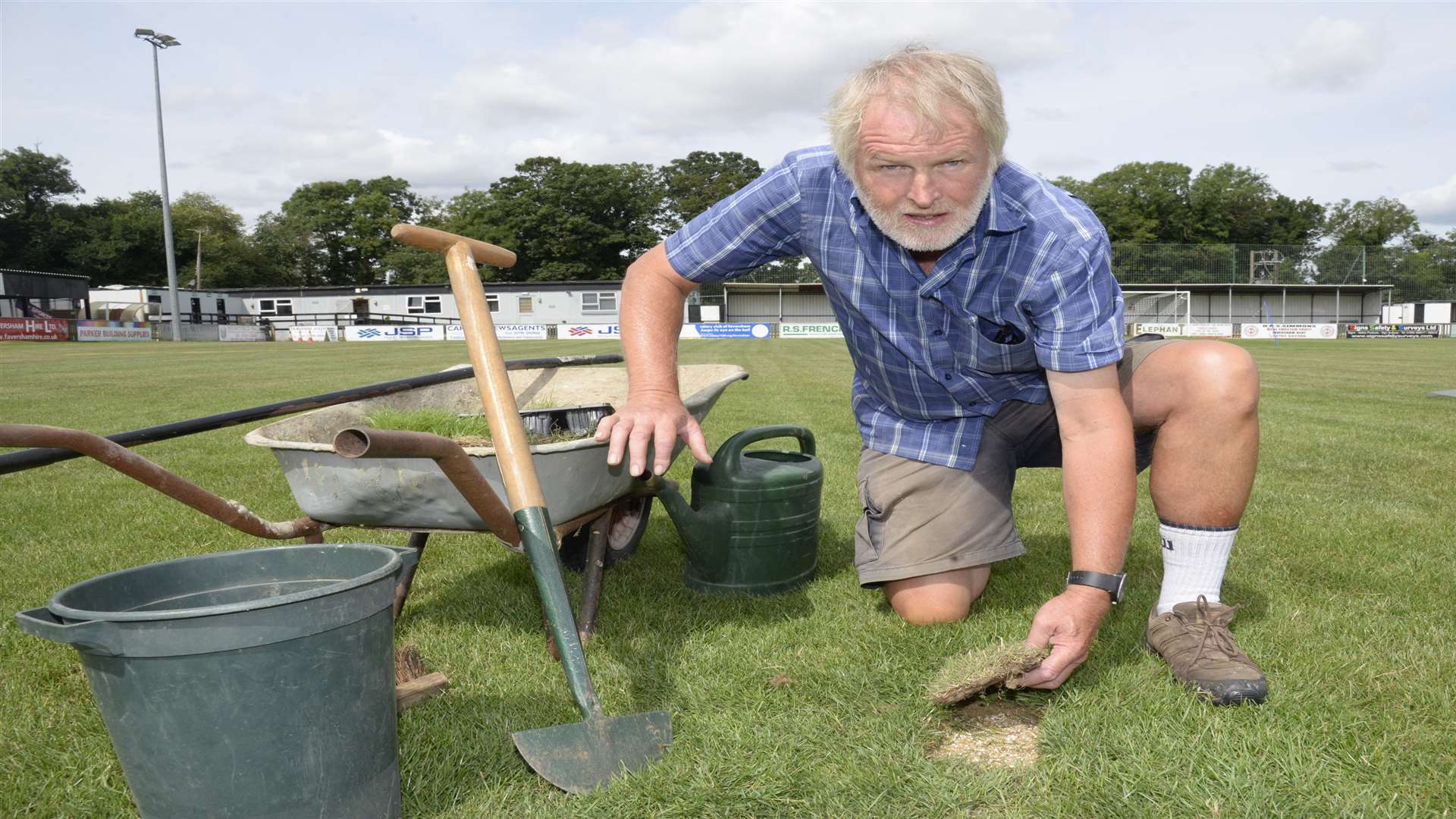 Volunteer Groundsman Lindsay Burden repairing damage done by rabbits to the Faversham Football ground in Salter's Lane. Picture: Chris Davey