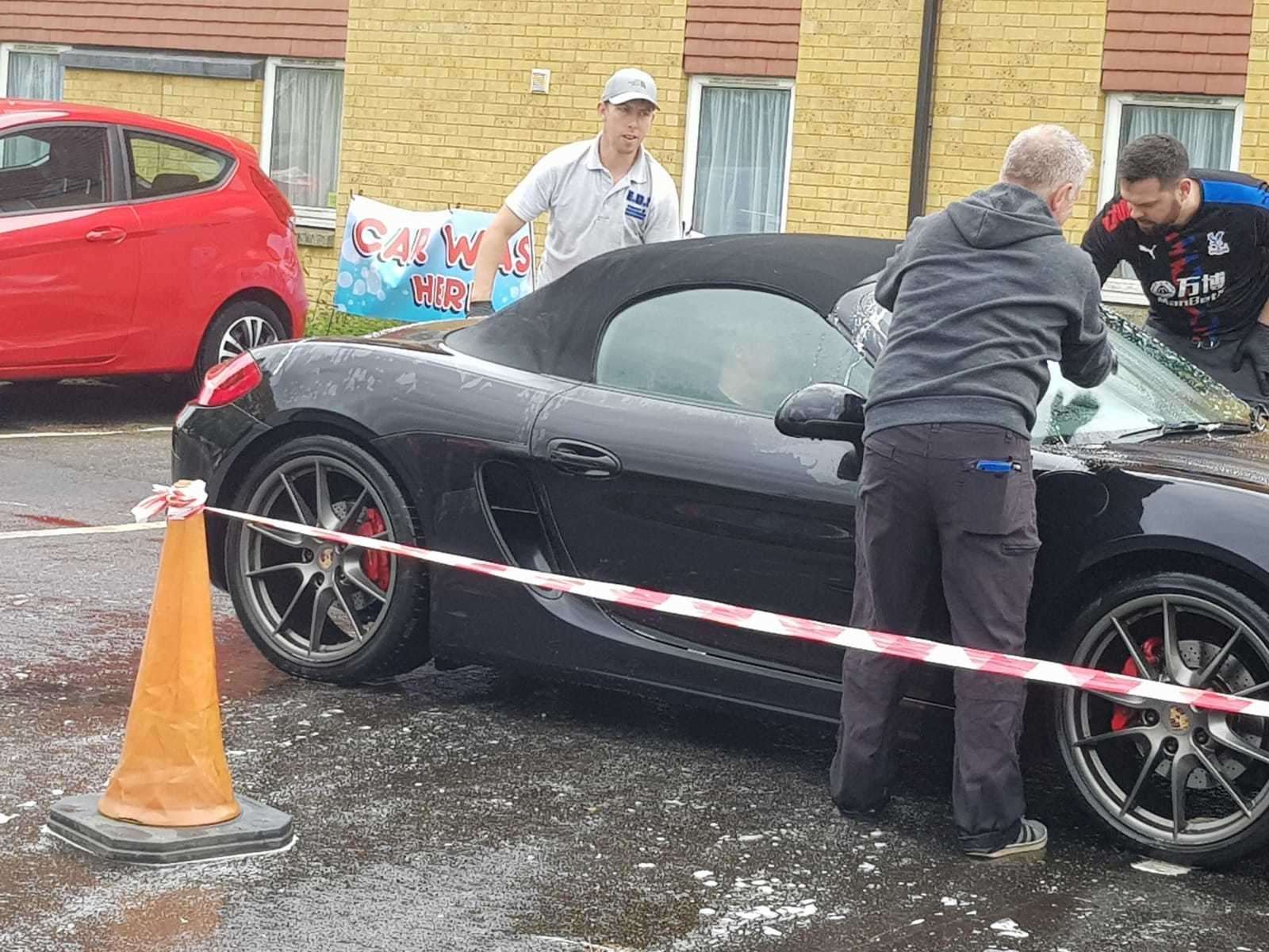 Volunteers join EDS Valet and Detailing Services to wash NHS staff cars for free at Darent Valley Hospital