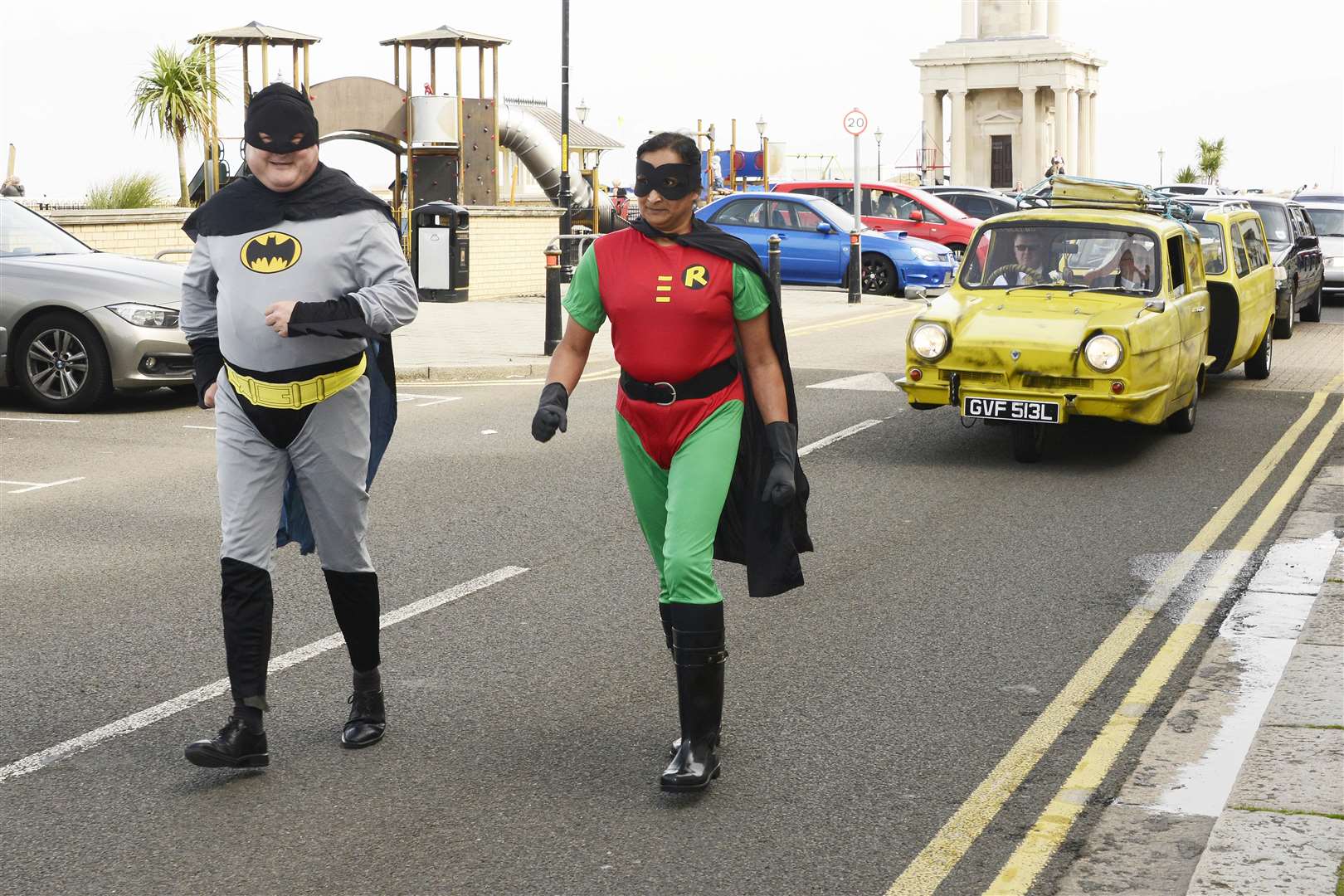 The funeral procession of Peter Wolstenholme goes past Herne Bay Central Parade with its Only Fools and Horses theme, with Batman and Robin running in front. Picture: Paul Amos