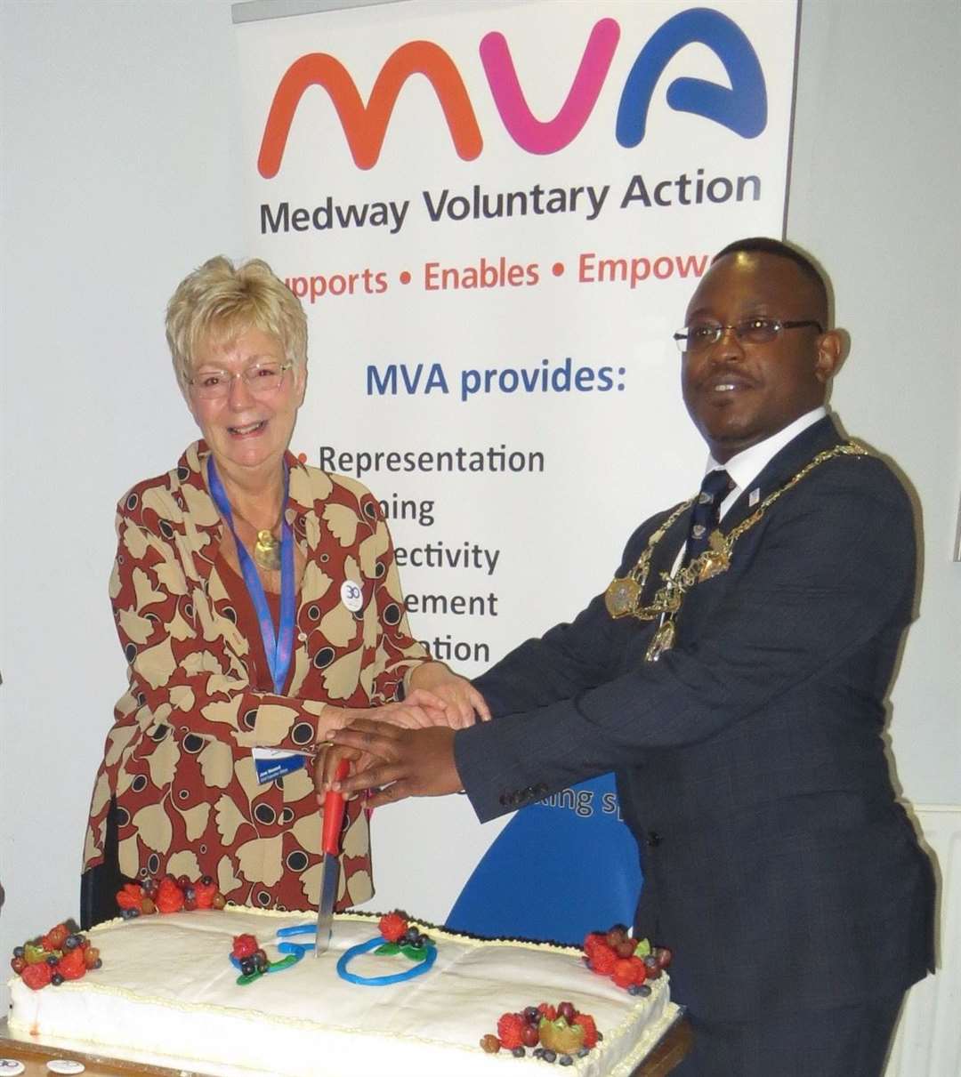 Jane Howard and the Mayor of Medway cutting the organisation's 30th anniversary celebration cake. Picture: MVA
