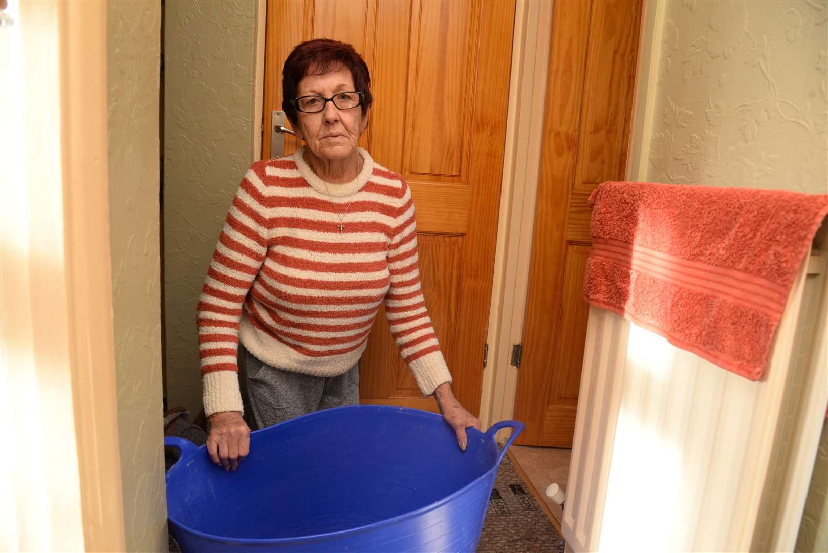 Theresa Tait in her leaking flat in Godwin Road, Thanington. Picture: Chris Davey