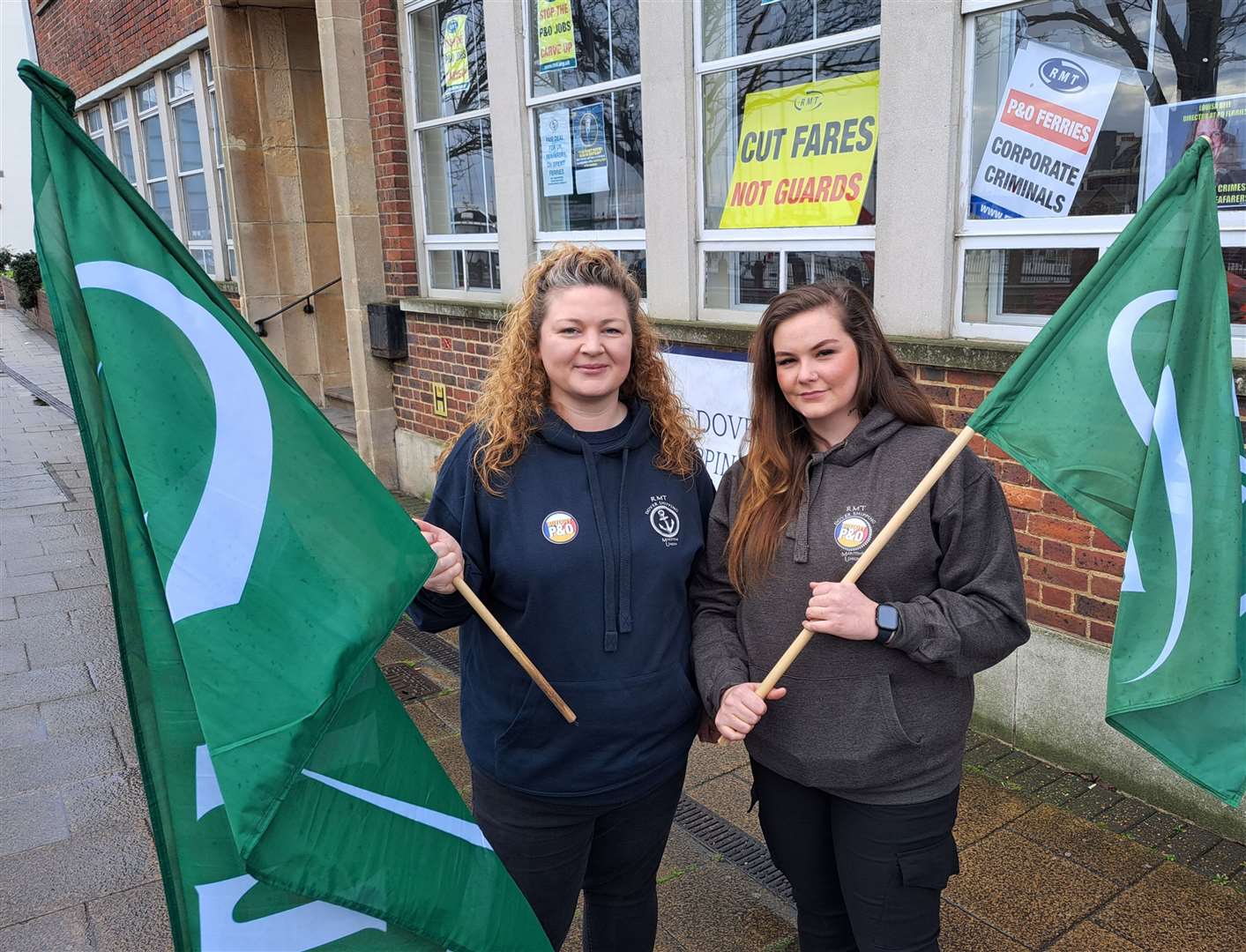 Jeanne Wilmot, left, Marie Ross with RMT flags