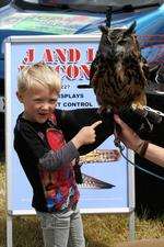 Luc Molletts, five, with Oscar a 32-year-old European Eagle Owl