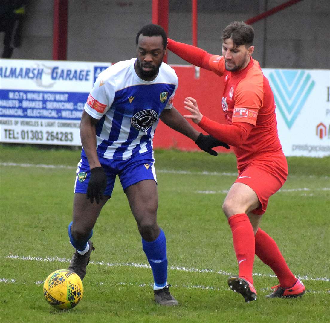 Hythe Town player-boss James Rogers, right, gets stuck in against VCD but was only 20 or 30 per cent fit Picture: Randolph File