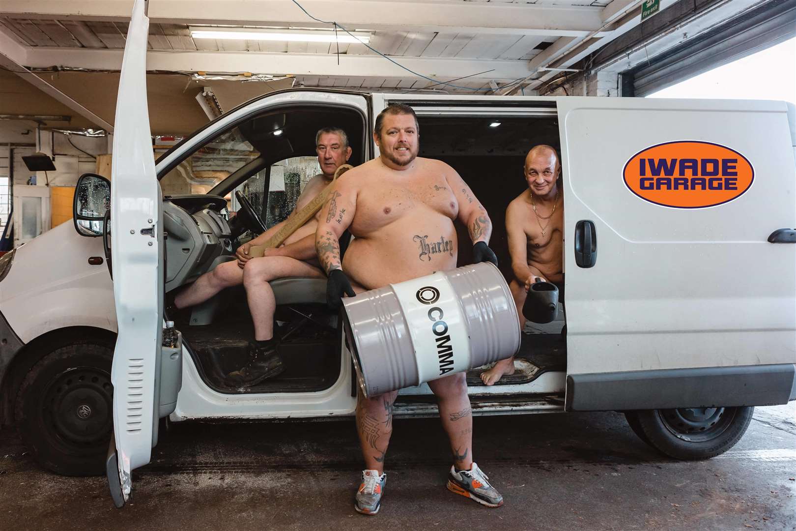 Iwade Garage's Gary Marsh, Roger Clark and Paul Knight pose for the calendar. Picture: Kate Hennessy