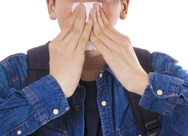 Flu symptoms can include a high temperature, dry cough and aches and pains. Image: Stock photo.