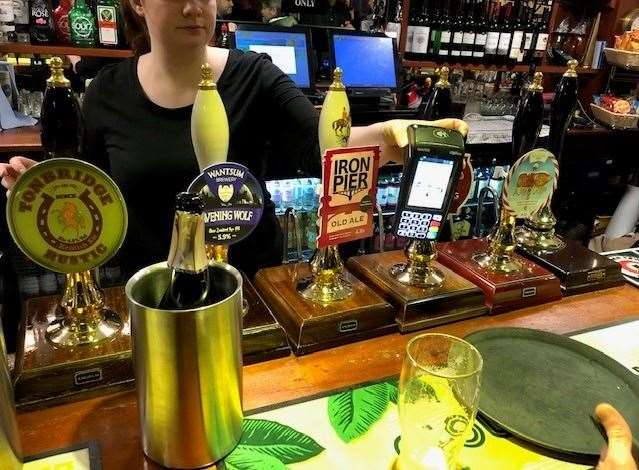 There were five beers available on tap and I’d have happily sampled any of them. In the end we chose a pint of Iron Pier’s Old Ale and a Bexley Brewery’s Crook Log (obscured in this photo by barmaid Holly’s card machine).