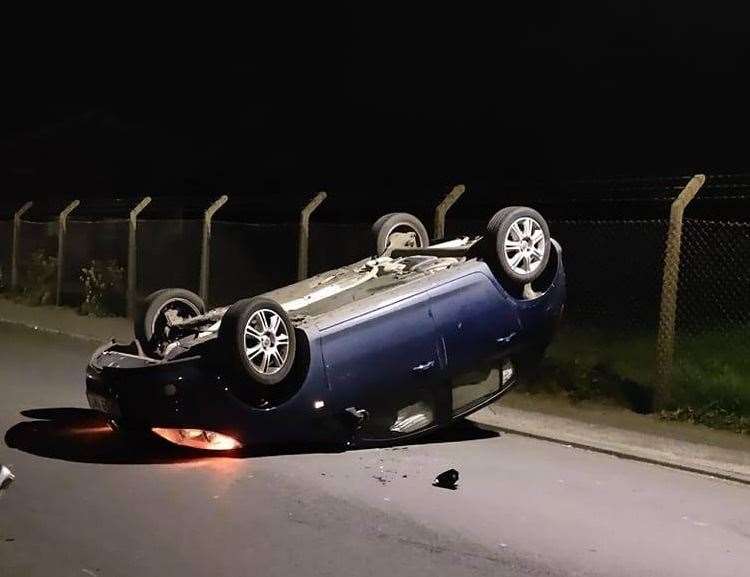 A car on its roof in St Richards Road in Walmer