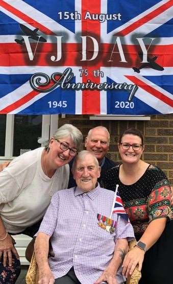 Leslie Burkett on VJ Day with his daughter Irene, son-in-law Deryck and granddaughter Amie