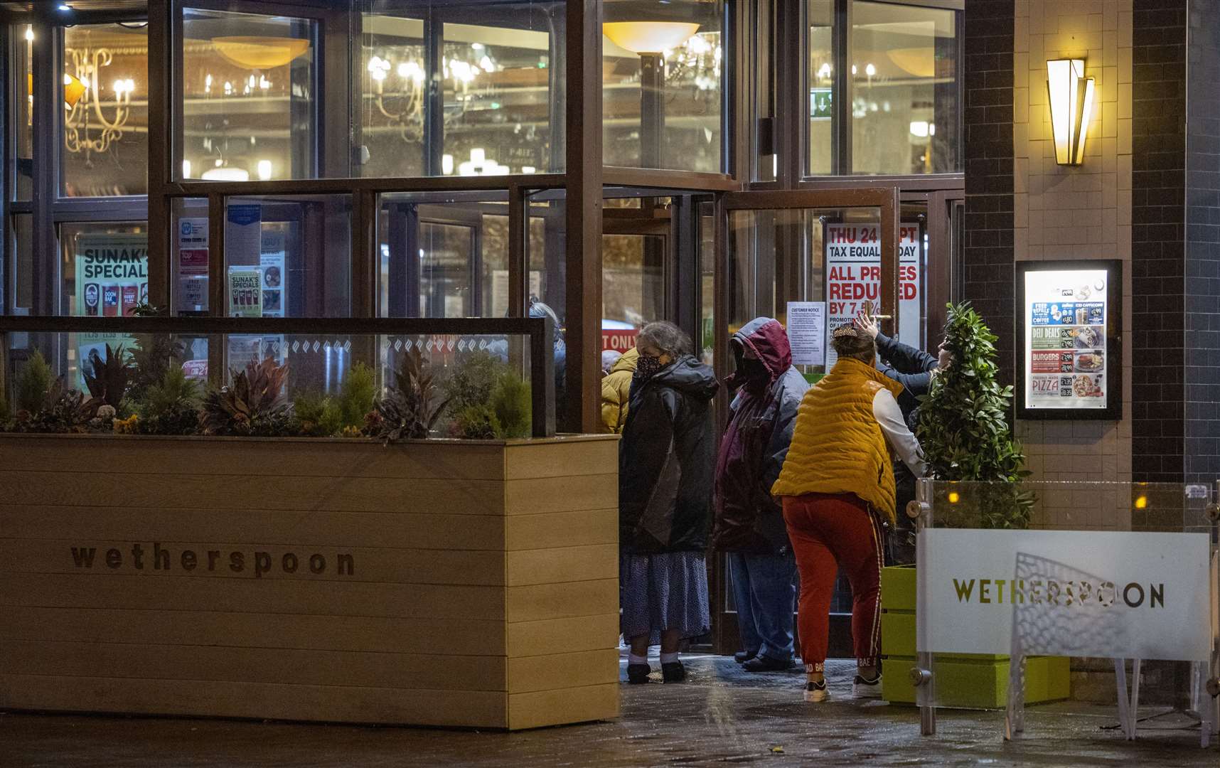 People queuing outside a Wetherspoons pub in Blackpool (Peter Byrne/PA)