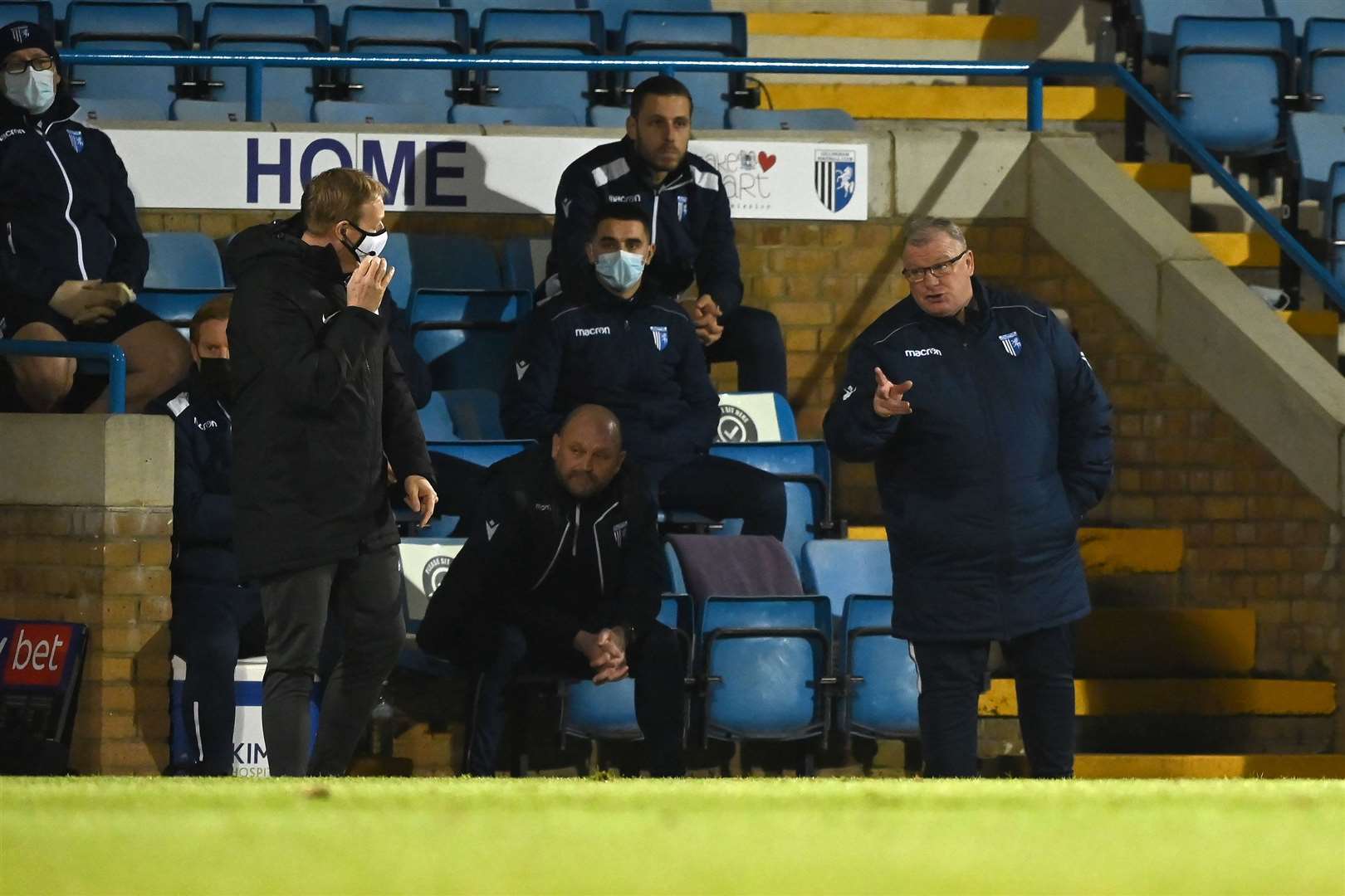 Steve Evans and fourth official Trevor Kettle in debate at Priestfield on Friday night Picture: Keith Gillard