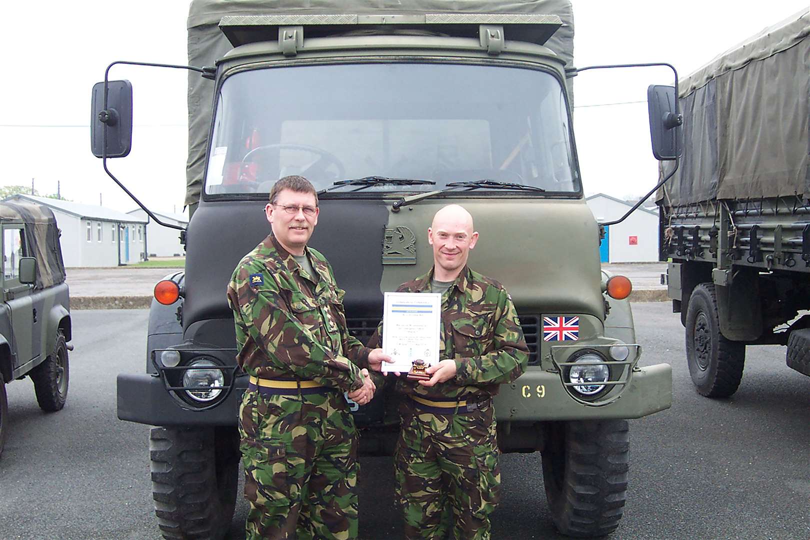 Wayne Couzens (right) was a Private from C Company, 3 PWWR with his certificate for passing out as top student on the Battalion-run driving course. Copyright.Emily Caroe MIPR.The Bennett-Caroe Partnership