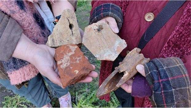 Finds from test pits included fragments of medieval window tracery, butchered animal bone and decorated late medieval or Tudor tile. Picture: Dover District Council