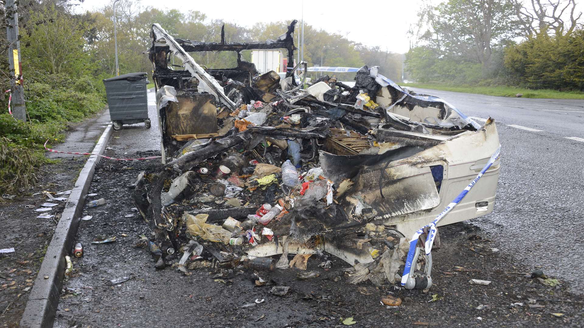 The remains of the caravan and its contents of rubbish after fire destroyed it in Hothfield.