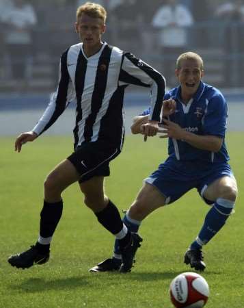 Tom Hickman, right, stays tight to his opponent against Heybridge Swifts on Saturday