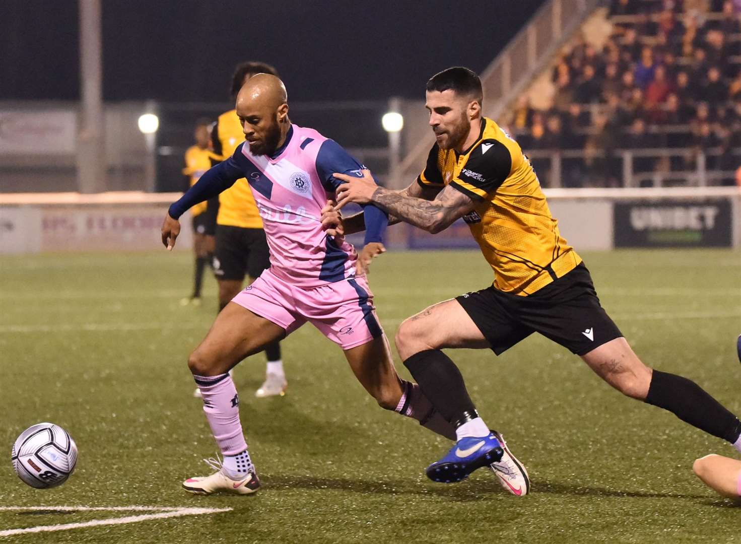 Maidstone winger Joan Luque puts a Dulwich Hamlet player under pressure during the Stones' 2-0 win on Tuesday. Picture: Steve Terrell