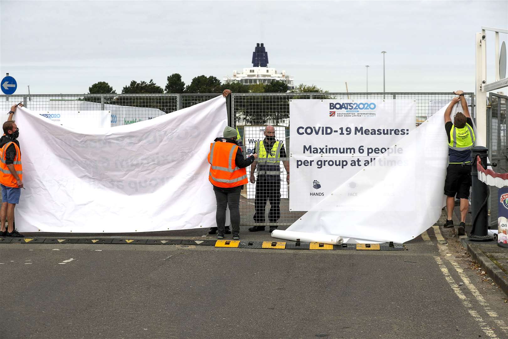Staff put up screens at the BOATS2020 show in Southampton following cancellation (Steve Parsons/PA)