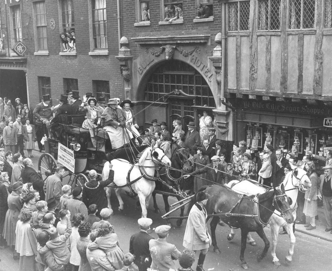 This Dickens coach was assembled to celebrate the centenary of Cobham Cricket Club in 1950 and is seen arriving at the Bull Hotel, Rochester, which figures in Pickwick Papers