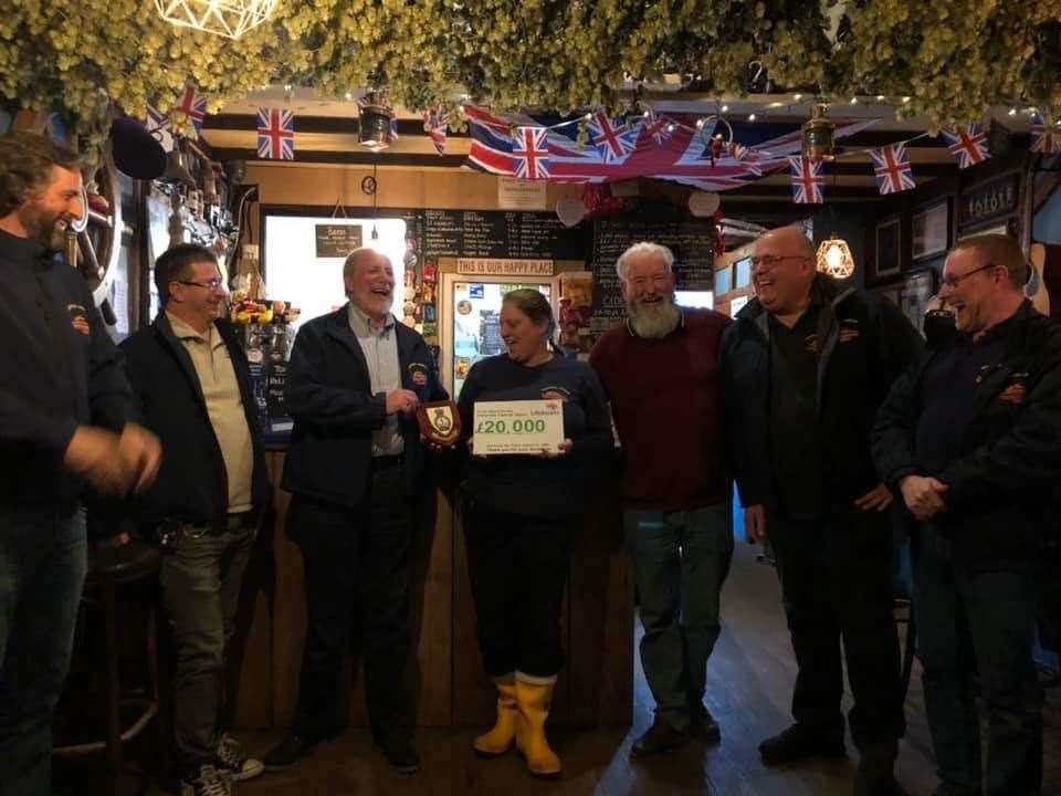 Rachel Collier and Chris Collier receiving a plaque at The Admiral's Arm in Queenborough