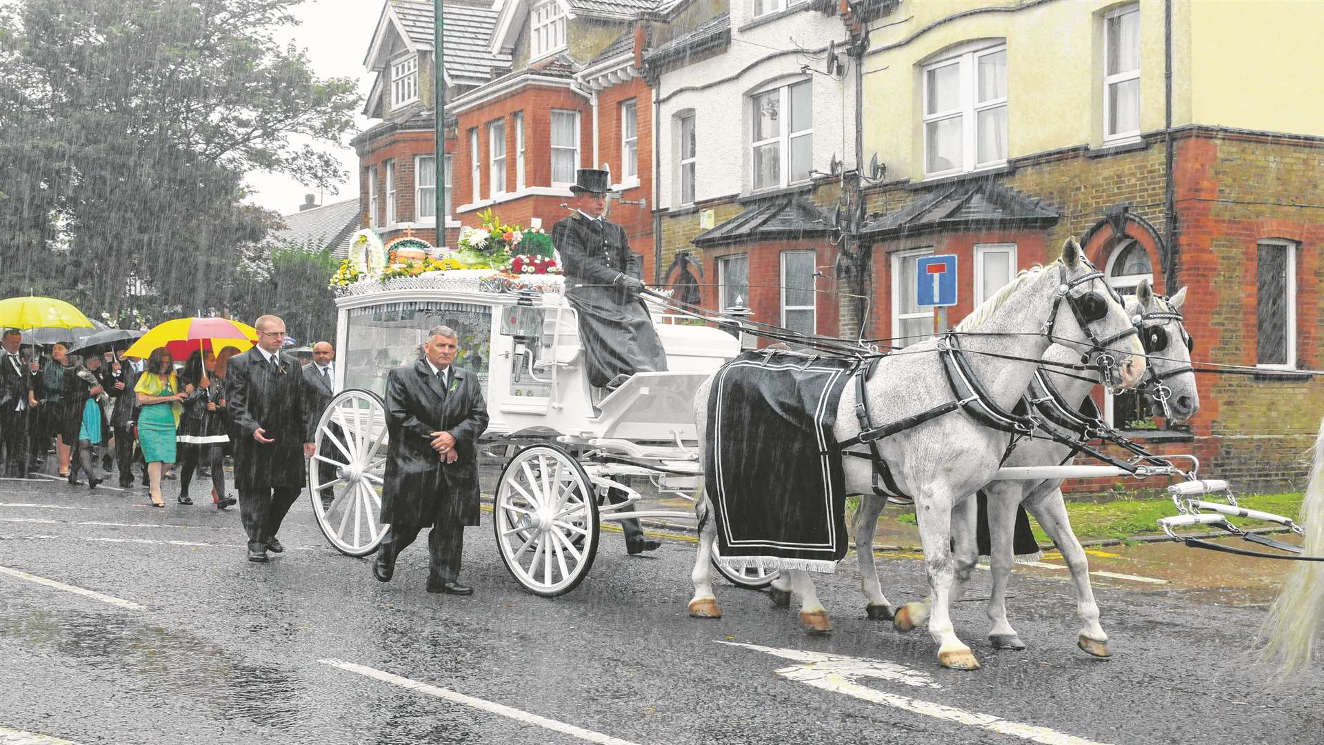 A horse drawn carriage arrives