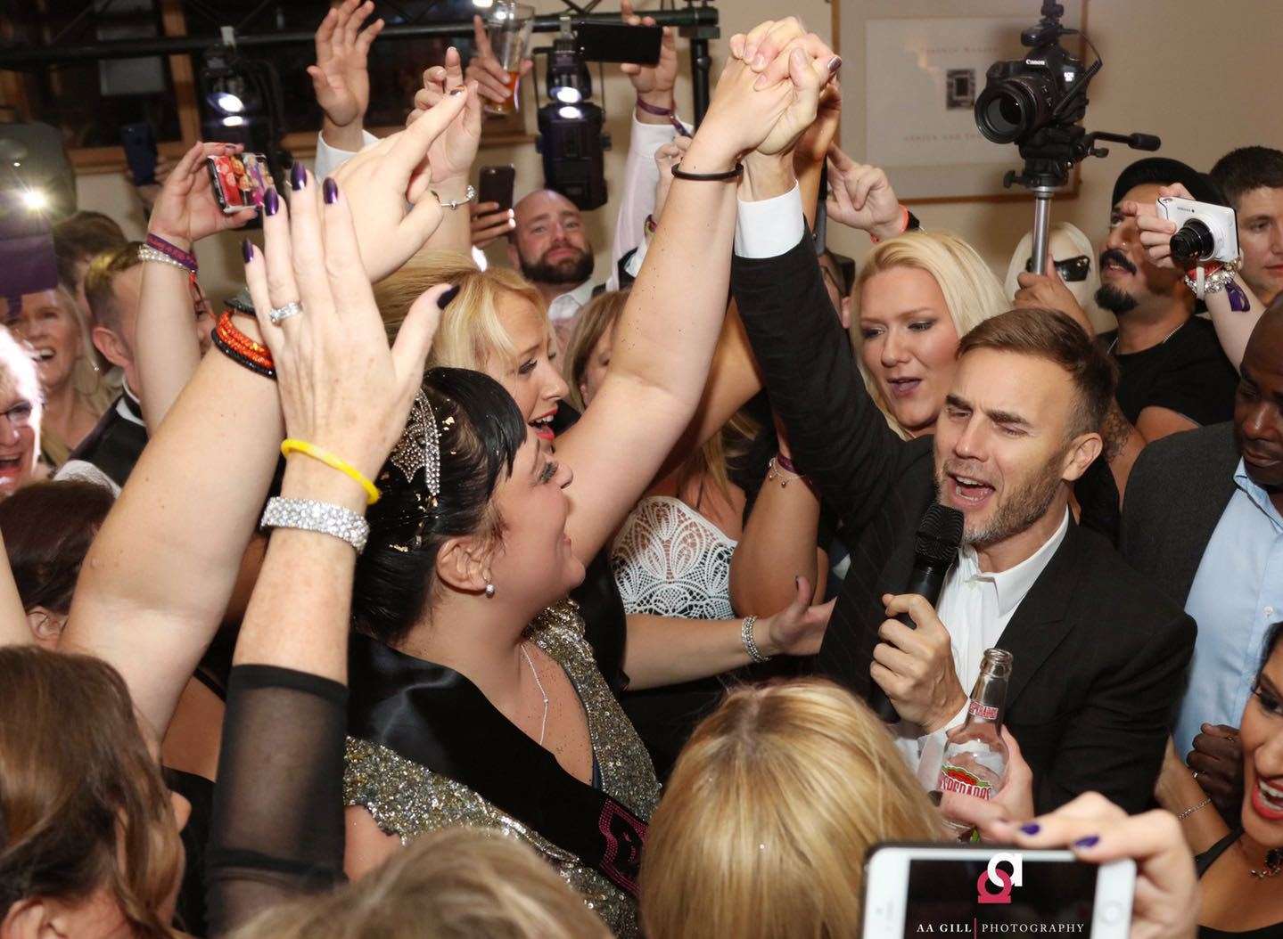 Gary Barlow is mobbed as he sings to lucky birthday girl Atty