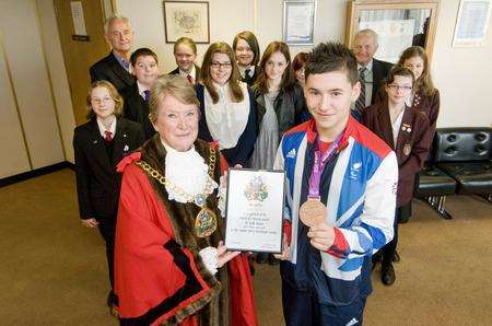 Ross Wilson receives his certificate from the Mayor of Swale, Cllr Pat Sandle, with members of Swale Youth Forum, Labour group leader Cllr Roger Truelove, left, and Cllr George Bobbin