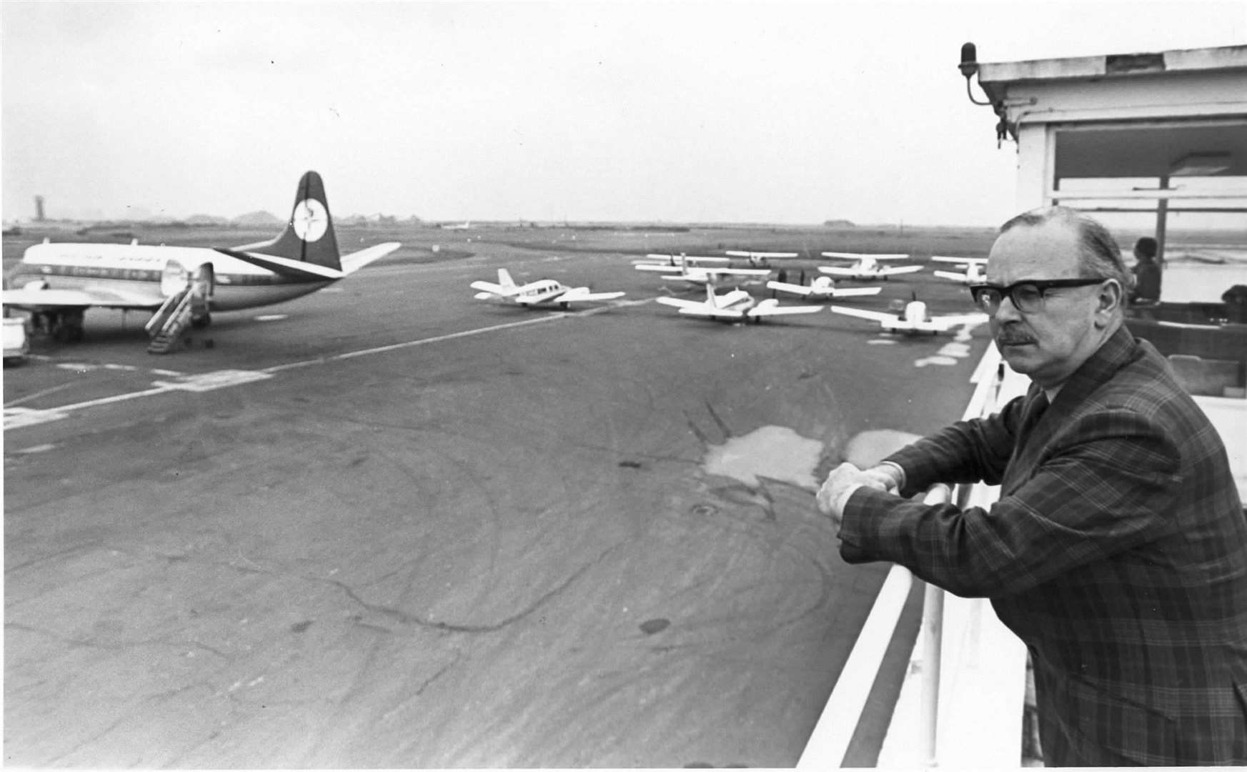 The manager of Lydd Airport looking out over the runway in February 1978