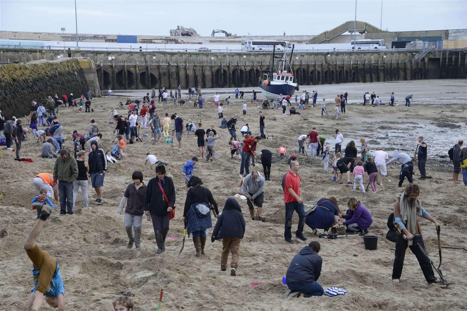 After the gold was buried, people rushed to the beach to dig. Picture: Paul Amos