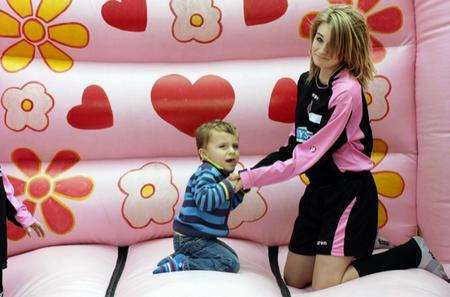 Finley Steers, 2 and Amy Thomas, 13 on the bouncy castle