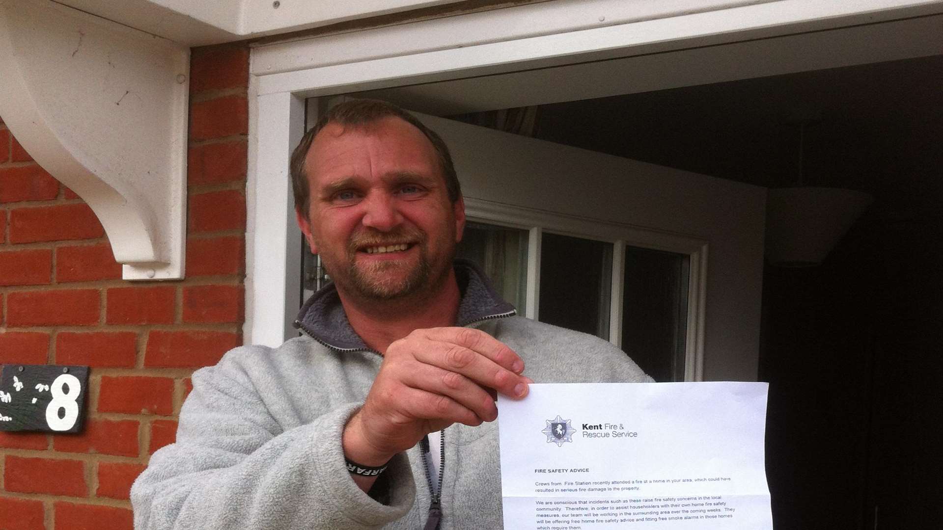 Alan Todd with the letter posted by firefighters