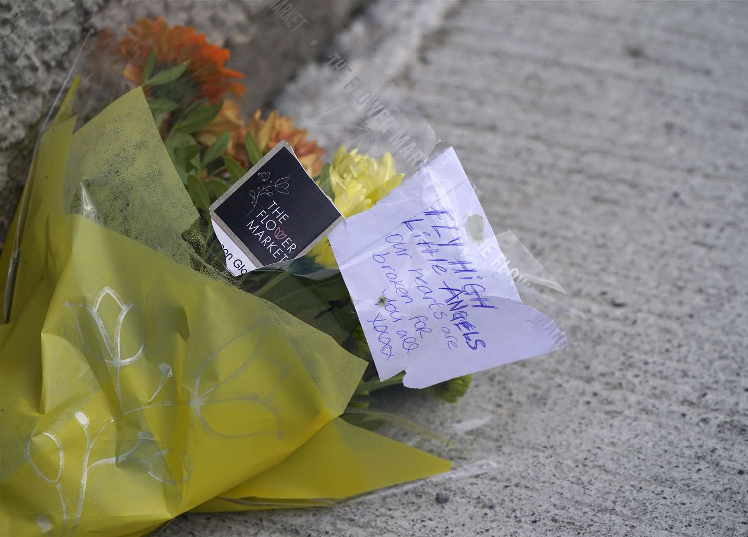 Flowers have been left at the scene in the Rossfield Estate in Tallaght, Dublin, after the deaths of 18-year-old woman and her brother and sister (Niall Carson/PA)