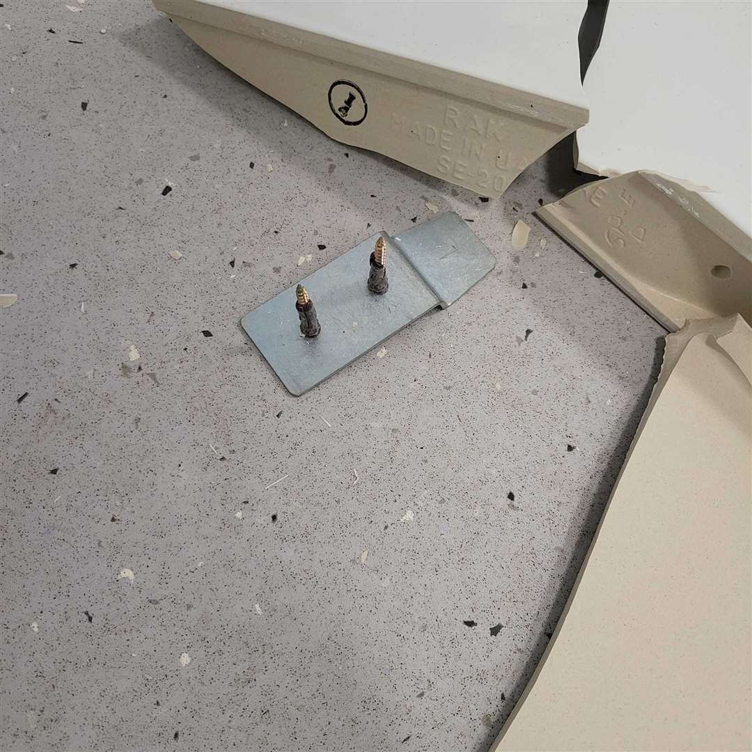 Screws were left facing up on the floor of the toilets