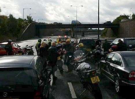 Police have closed an M25 carriageway amid concerns for the welfare of a woman on a bridge
