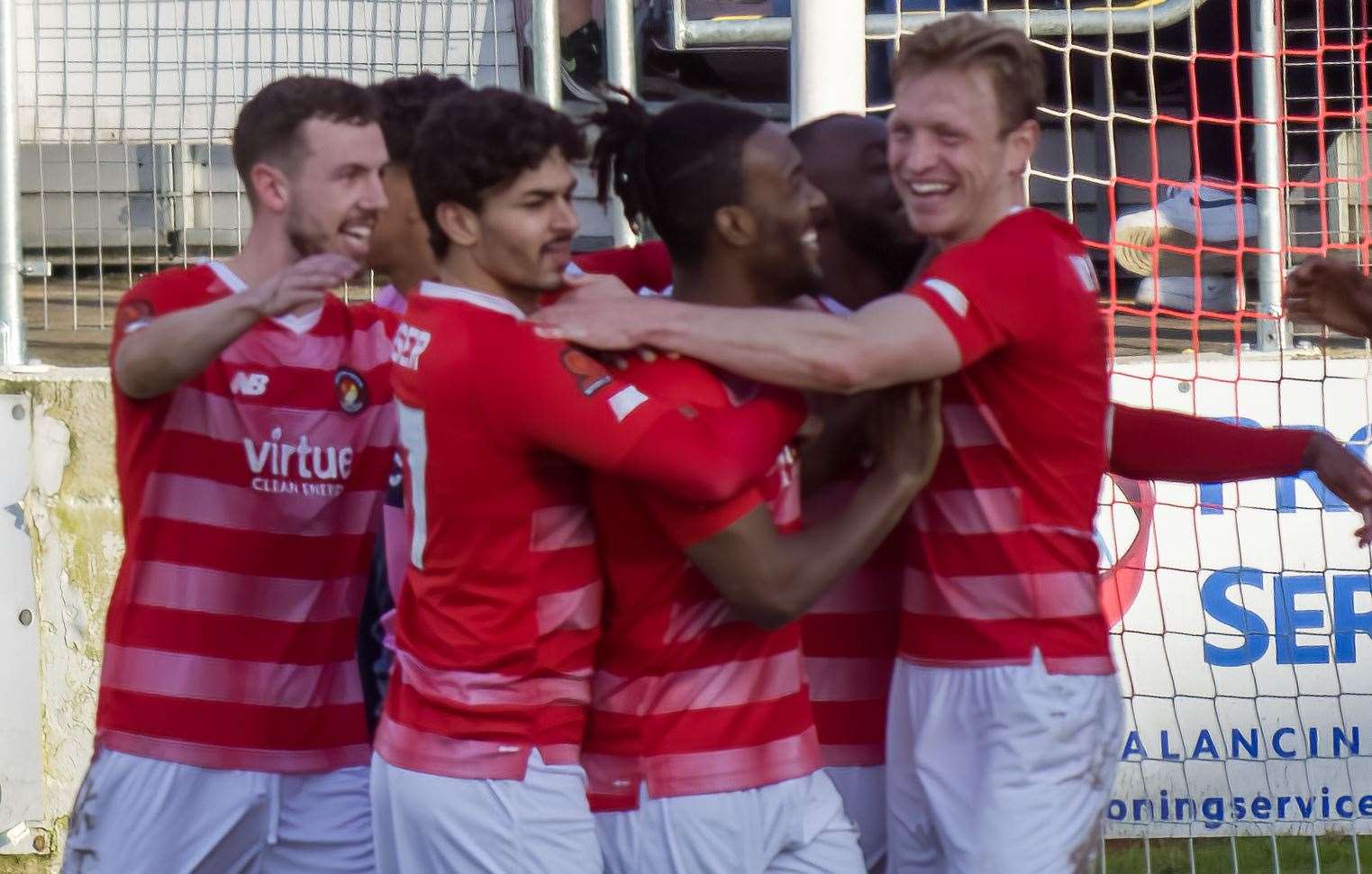 Ebbsfleet players celebrate with Dominic Poleon after he scored his fourth goal against Dulwich. Picture: Ed Miller/EUFC