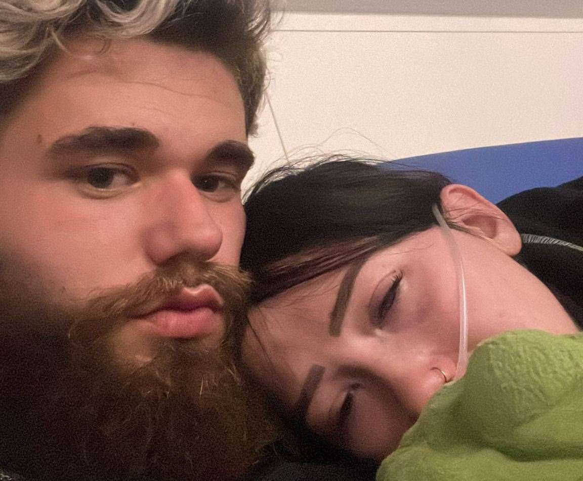 Blissica with her partner Zach, 21, in a hospital ward after she suffered a seizure. Picture: SWNS