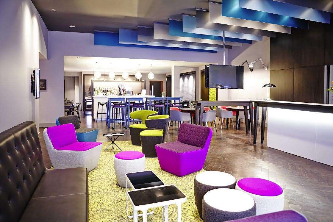 Colourful reception and bar at Ibis Styles hotel in Liverpool.