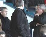 IN THE FRAME: Gillingham chairman Paul Scally speaks to Micky Adams, far left, at Ninian Park. Picture: GRANT FALVEY
