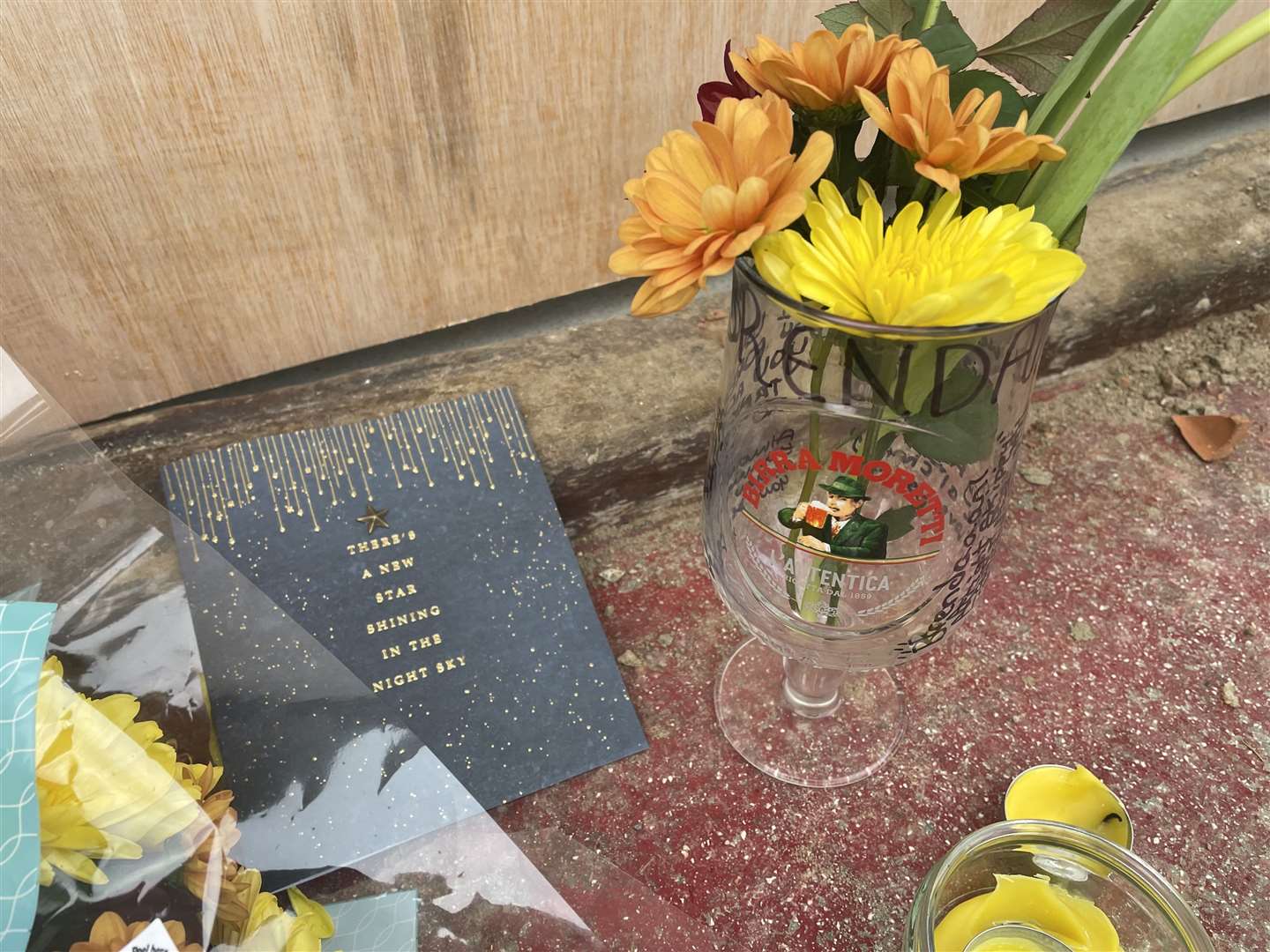 A card has been left with flowers and a candle at the scene of the crash in London Road, Deal
