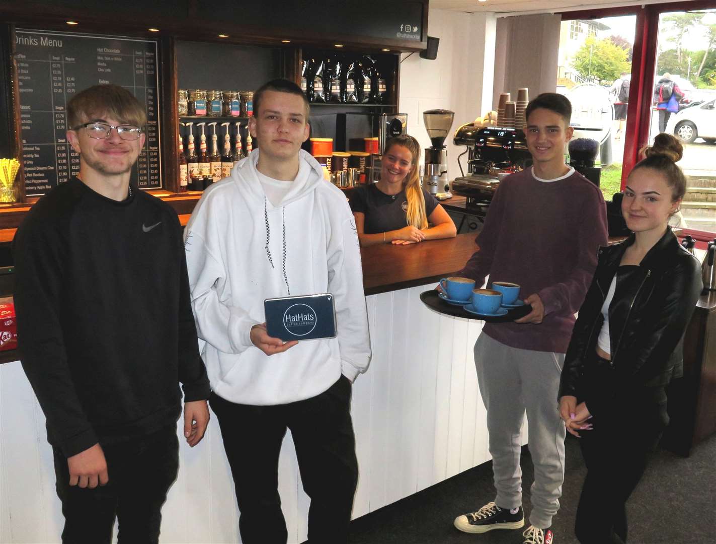 Btec entrepreneur students (left to right) Luke Squire, Joe Wilson, Kieran Purkiss and Katie Bevan with HatsHats manager Charlotte Thomson (19362140) (19370052)